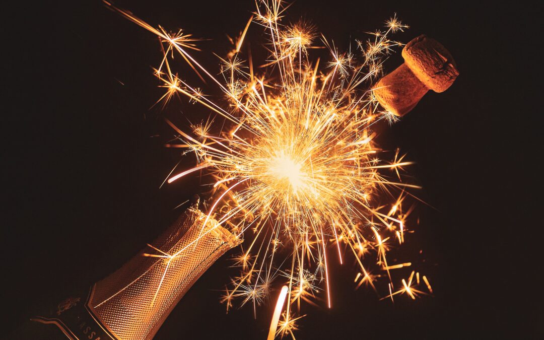 Champagne bottle being uncorked with firework
